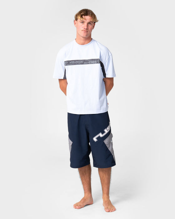 man-wearing-akimbo-fixed-waist-boardshort-in-navy-blue