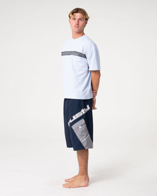 Man wearing Akimbo Fixed Waist Boardshort in Navy Blue
