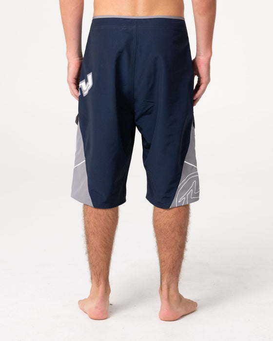man-wearing-akimbo-fixed-waist-boardshort-in-navy-blue