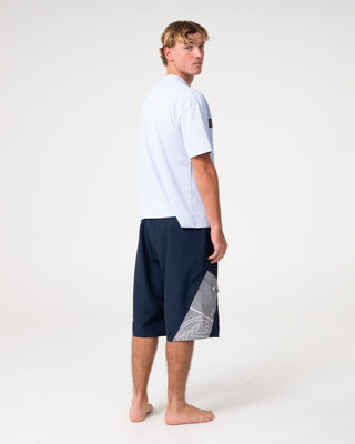 Man wearing Akimbo Fixed Waist Boardshort in Navy Blue
