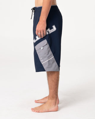 Man wearing Akimbo Fixed Waist Boardshort in Navy Blue