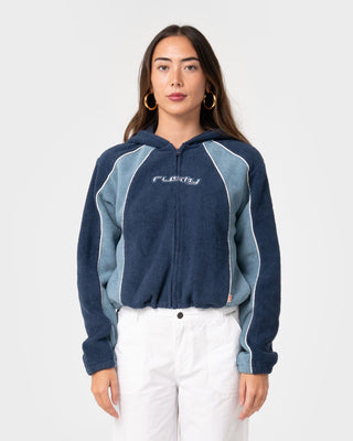 Woman wearing Mini Two Tides Zip Through Polar Fleece in Atlantic Blue