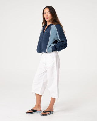 Woman wearing Mini Two Tides Zip Through Polar Fleece in Atlantic Blue