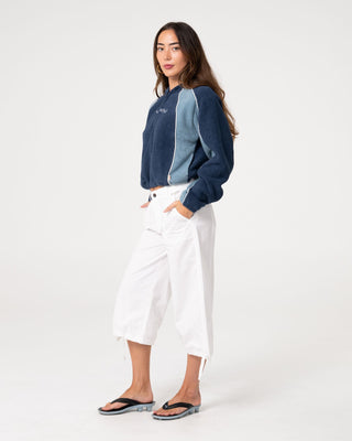Woman wearing Mini Two Tides Zip Through Polar Fleece in Atlantic Blue
