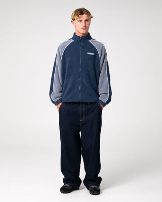 Man wearing Pimp My Tides Zip Thru Sherpa Fleece in Navy Blue