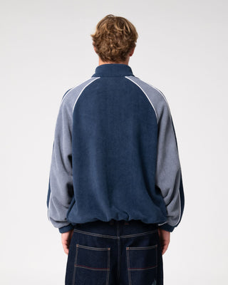 Man wearing Pimp My Tides Zip Thru Sherpa Fleece in Navy Blue