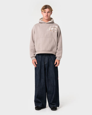 Man wearing Uncut Gems Hooded Fleece in Stone