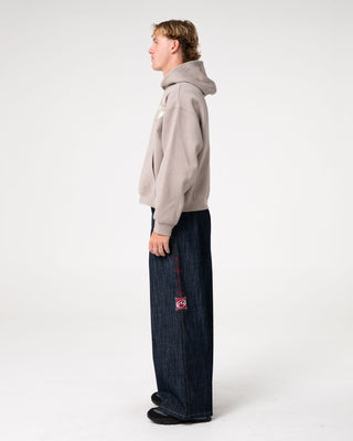 Man wearing Uncut Gems Hooded Fleece in Stone