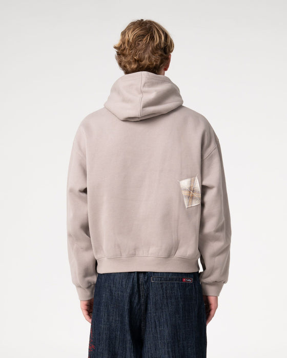 man-wearing-uncut-gems-hooded-fleece-in-stone