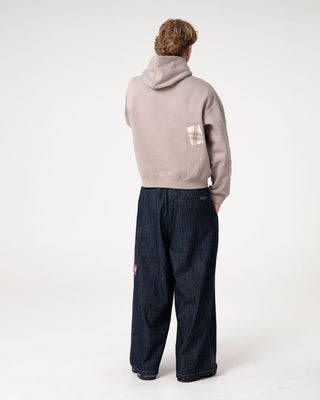 Man wearing Uncut Gems Hooded Fleece in Stone