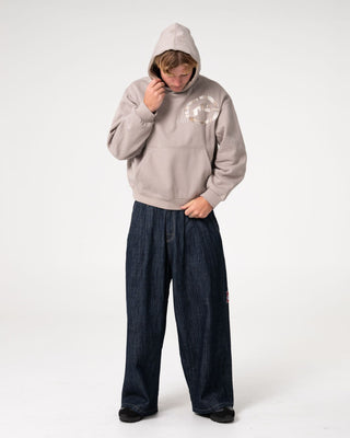 Man wearing Uncut Gems Hooded Fleece in Stone