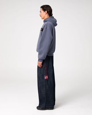 Man wearing Big Ticket Hooded Fleece in Steel