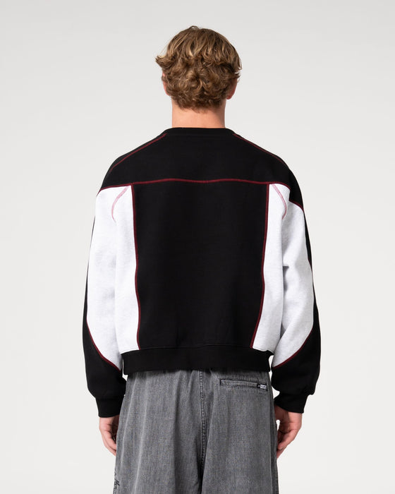 man-wearing-sawblaze-crew-neck-fleece-in-black