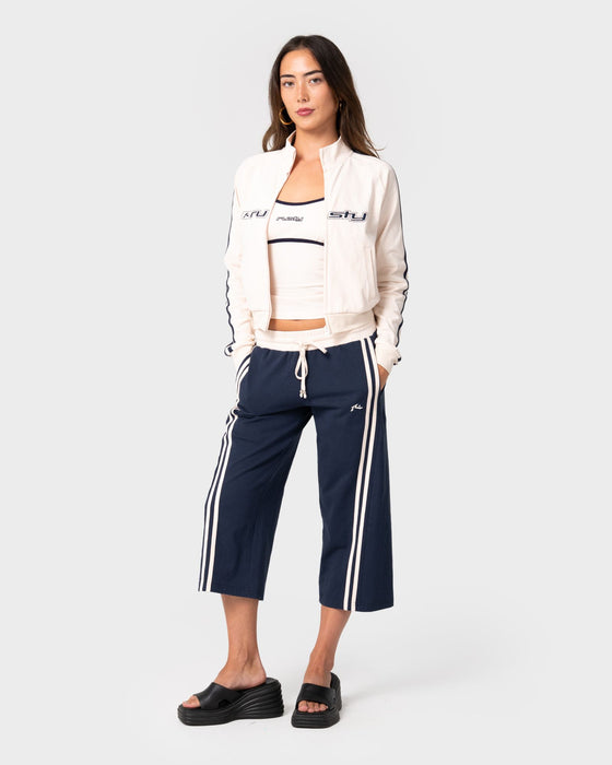woman-wearing-maneater-fitted-zip-through-track-jacket-in-egret