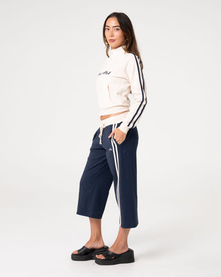Woman wearing Maneater Fitted Zip Through Track Jacket in Egret