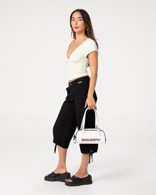 Woman wearing Cameron Low Rise Relaxed Capri Pant in Black