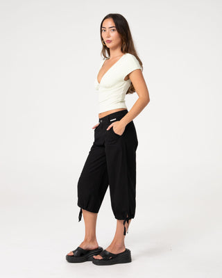 Woman wearing Cameron Low Rise Relaxed Capri Pant in Black