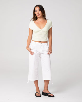 Woman wearing Cameron Low Rise Relaxed Capri Pant in White