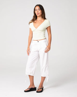 Woman wearing Cameron Low Rise Relaxed Capri Pant in White
