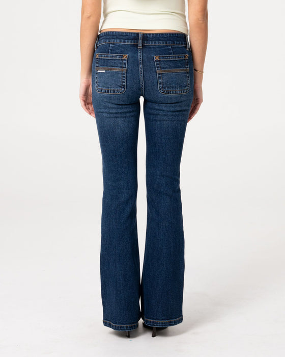 woman-wearing-lindsay-low-rise-boot-leg-denim-jean-in-walk-of-shame