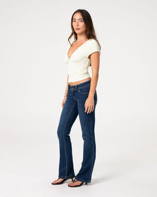 Woman wearing Lindsay Low Rise Boot Leg Denim Jean in Walk Of Shame