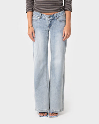 Woman wearing Lori Super Low Rise Wide Leg Denim Jean in Worn Out