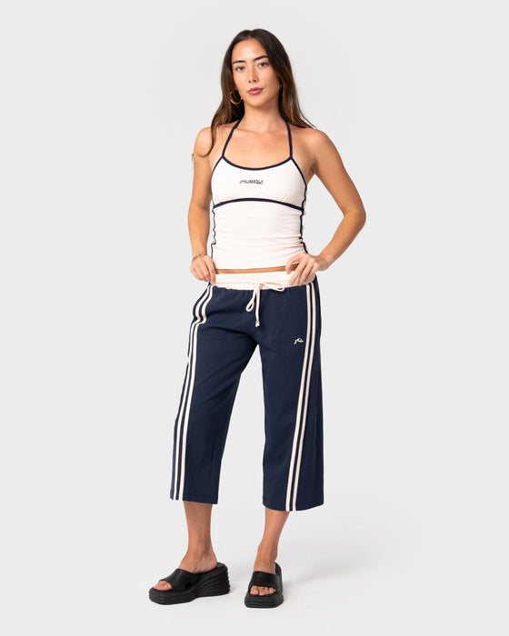 woman-wearing-maneater-low-rise-capri-track-pant-in-navy-blue