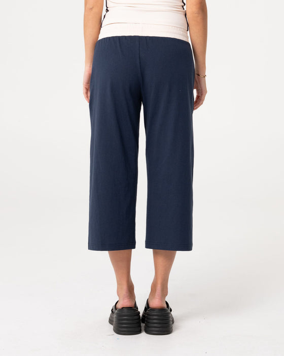woman-wearing-maneater-low-rise-capri-track-pant-in-navy-blue