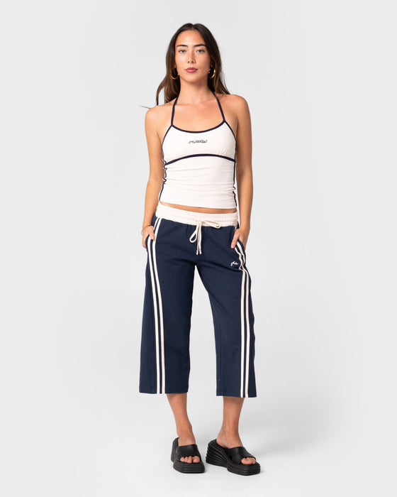 woman-wearing-maneater-low-rise-capri-track-pant-in-navy-blue