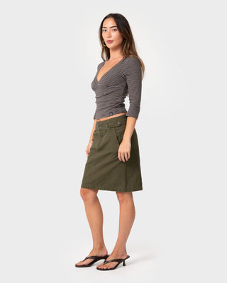 Woman wearing Feebee Low Rise Midi Skirt in Khaki