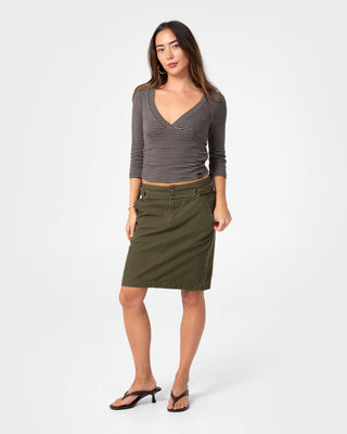 Woman wearing Feebee Low Rise Midi Skirt in Khaki