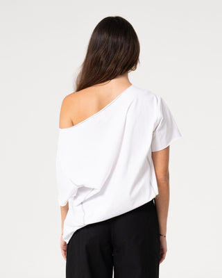 Woman wearing Kick It Cut Off Shoulder Tee in Vintage White