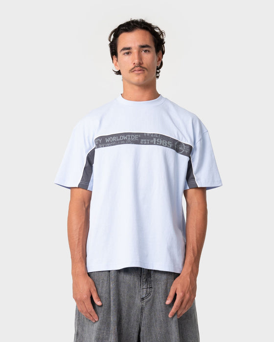 man-wearing-big-ticket-short-sleeve-tee-in-ice-blue