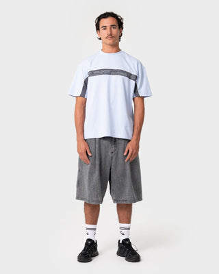Man wearing Big Ticket Short Sleeve Tee in Ice Blue