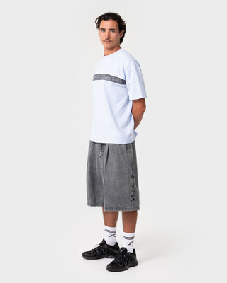 Man wearing Big Ticket Short Sleeve Tee in Ice Blue