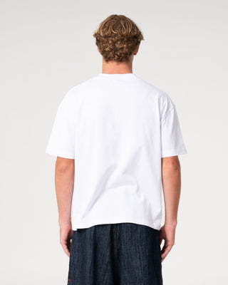 Man wearing Big Ticket Short Sleeve Tee in White