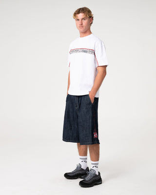 Man wearing Big Ticket Short Sleeve Tee in White