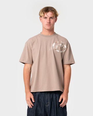 Man wearing Uncut Gems Short Sleeve Tee in Mushroom