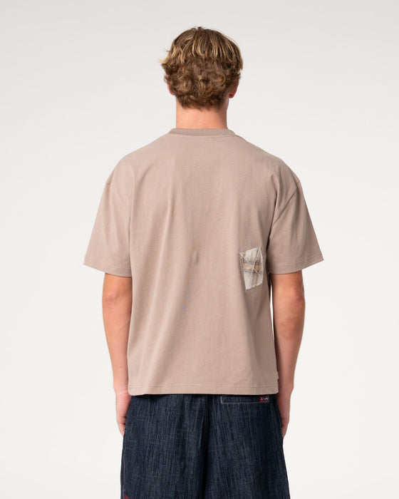 man-wearing-uncut-gems-short-sleeve-tee-in-mushroom