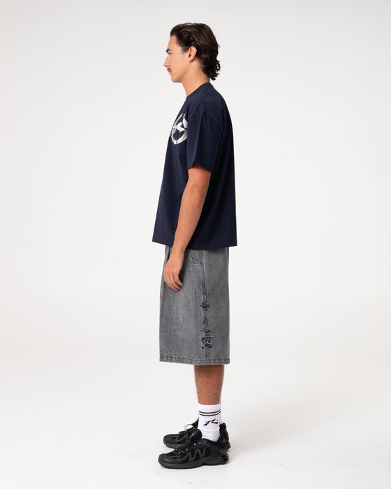man-wearing-uncut-gems-short-sleeve-tee-in-navy-blue