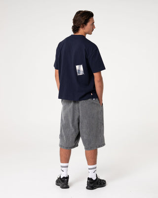 Man wearing Uncut Gems Short Sleeve Tee in Navy Blue