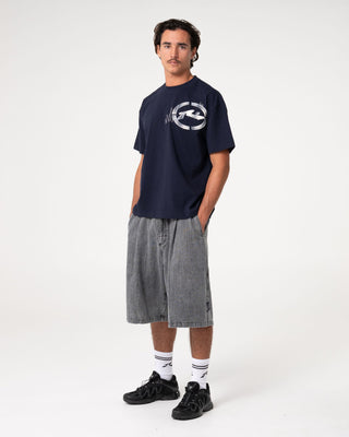 Man wearing Uncut Gems Short Sleeve Tee in Navy Blue