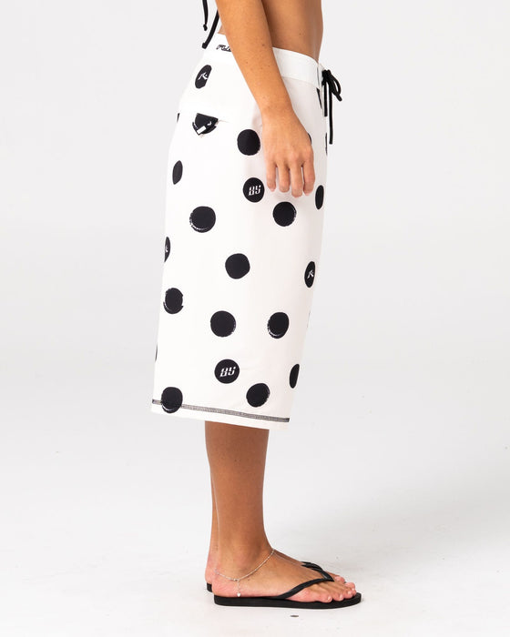 woman-wearing-phelps-fixed-waist-boardshort-in-egret