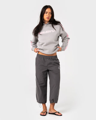 Woman wearing Timmy Target Oversize Hooded Fleece in Grey / Pink