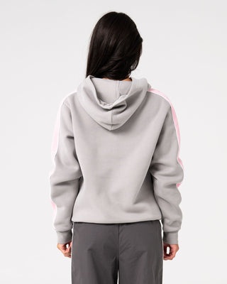 Woman wearing Timmy Target Oversize Hooded Fleece in Grey / Pink