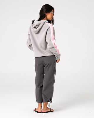 Woman wearing Timmy Target Oversize Hooded Fleece in Grey / Pink