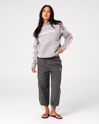 Woman wearing Timmy Target Oversize Hooded Fleece in Grey / Pink