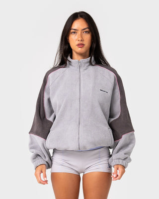 Woman wearing Coach Zip Through Sherpa Fleece in Ultimate Grey