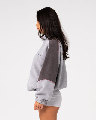 Woman wearing Coach Zip Through Sherpa Fleece in Ultimate Grey
