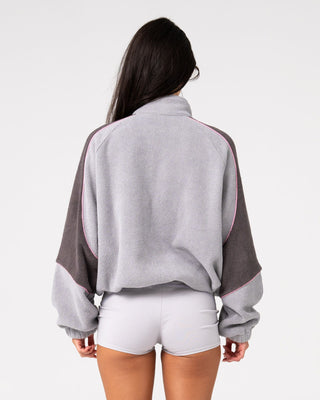 Woman wearing Coach Zip Through Sherpa Fleece in Ultimate Grey